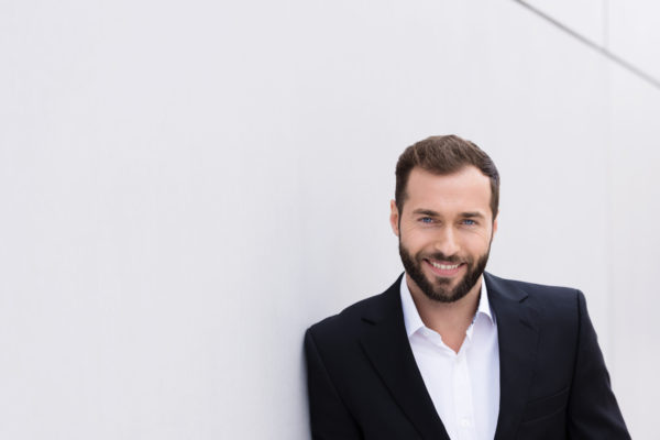 Good Looking Middle Age Man Leaning on Wall